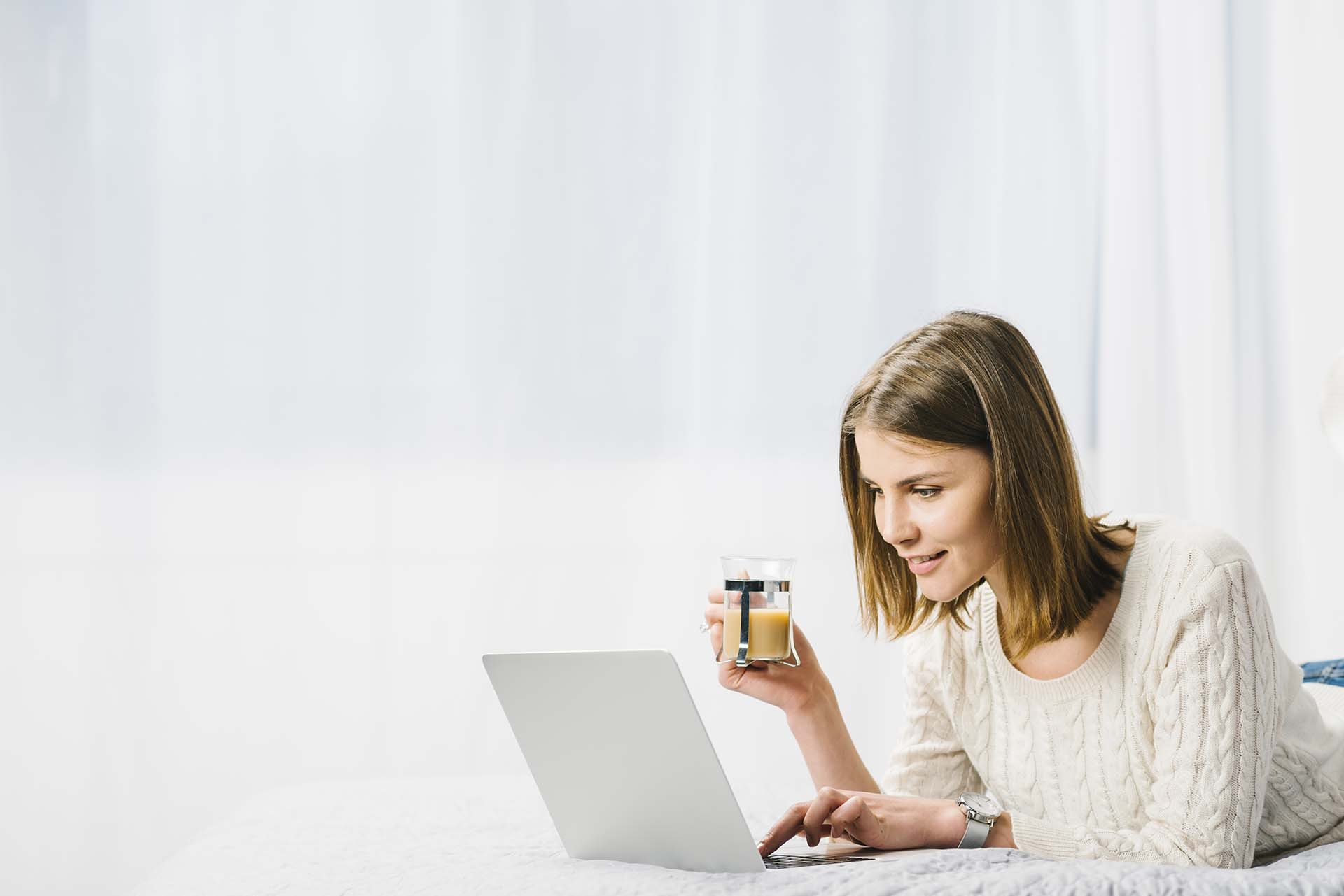 Editorial placeholder showing a professional using a laptop in natural light